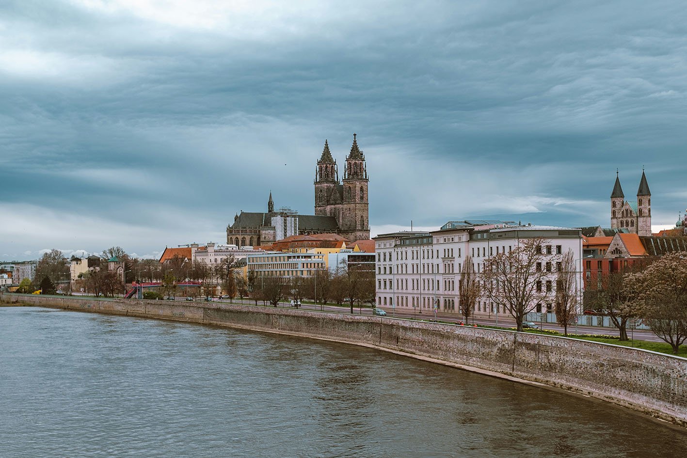 Photo by <a href="https://unsplash.com/@mijulshewrote?utm_source=unsplash&utm_medium=referral&utm_content=creditCopyText">IKECHUKWU JULIUS UGWU</a> on <a href="https://unsplash.com/photos/a-river-running-through-a-city-next-to-tall-buildings-1ZSK93b8B_0?utm_source=unsplash&utm_medium=referral&utm_content=creditCopyText">Unsplash</a>
      