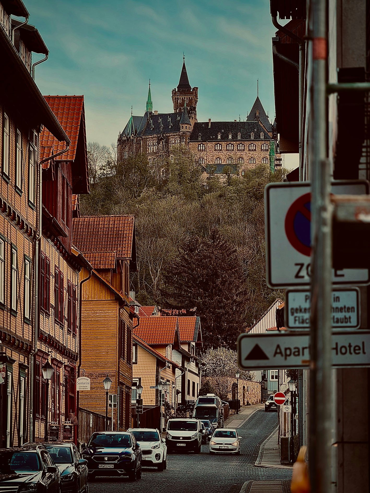 Photo by <a href="https://unsplash.com/@blicker?utm_source=unsplash&utm_medium=referral&utm_content=creditCopyText">Deep Radadia</a> on <a href="https://unsplash.com/photos/a-city-street-with-a-castle-in-the-background-fyhyCldD5R4?utm_source=unsplash&utm_medium=referral&utm_content=creditCopyText">Unsplash</a>
      